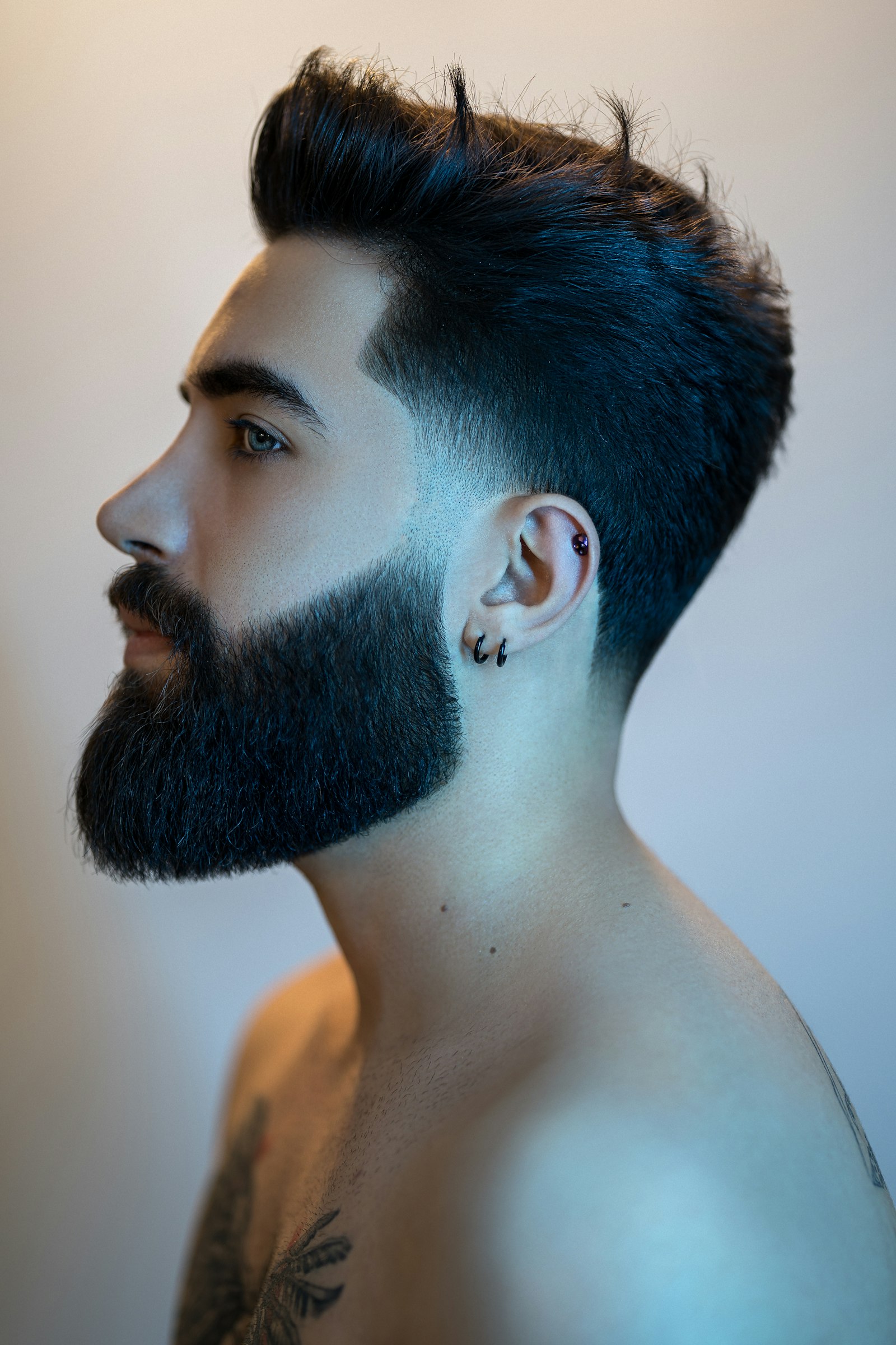 Finished profile: pompadour fade and sculpted beard