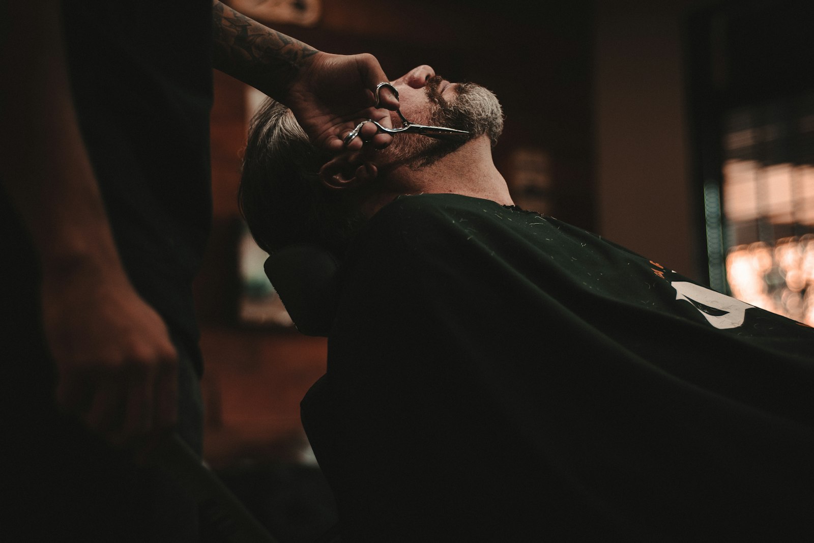 Beard trim under the back-bar lights
