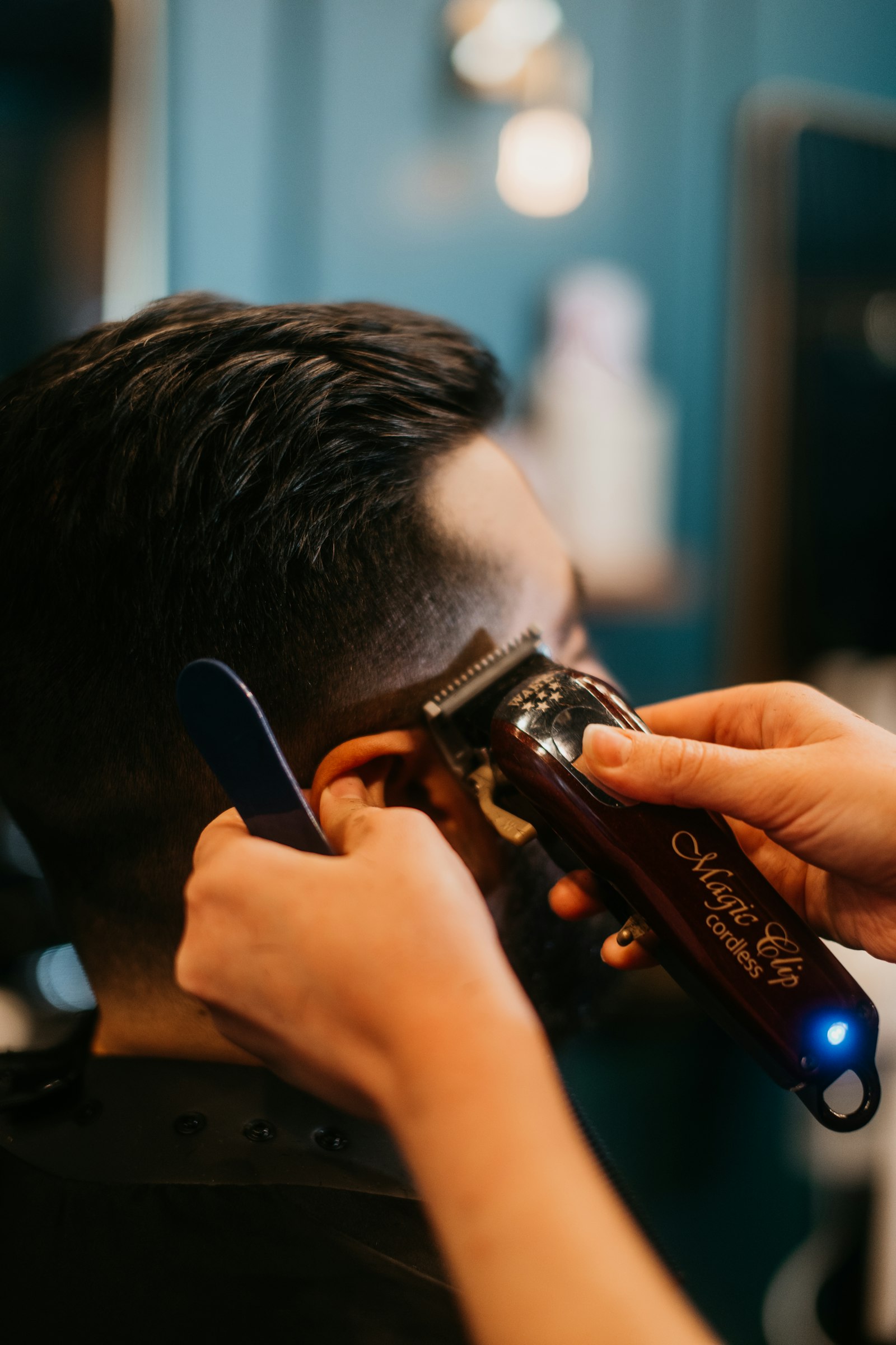 Cordless clipper detailing behind the ear