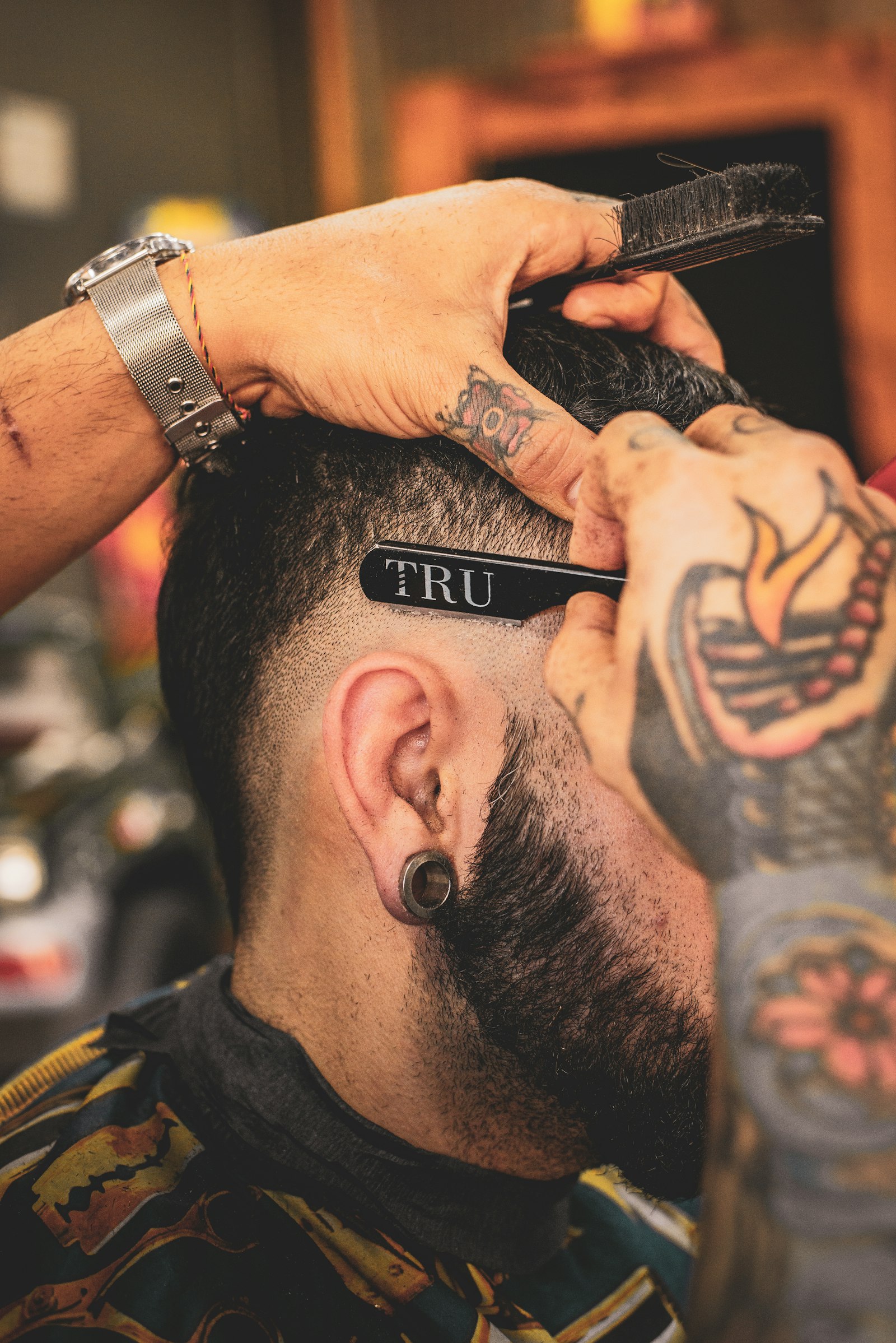 Sam Volkov working a straight razor lineup
